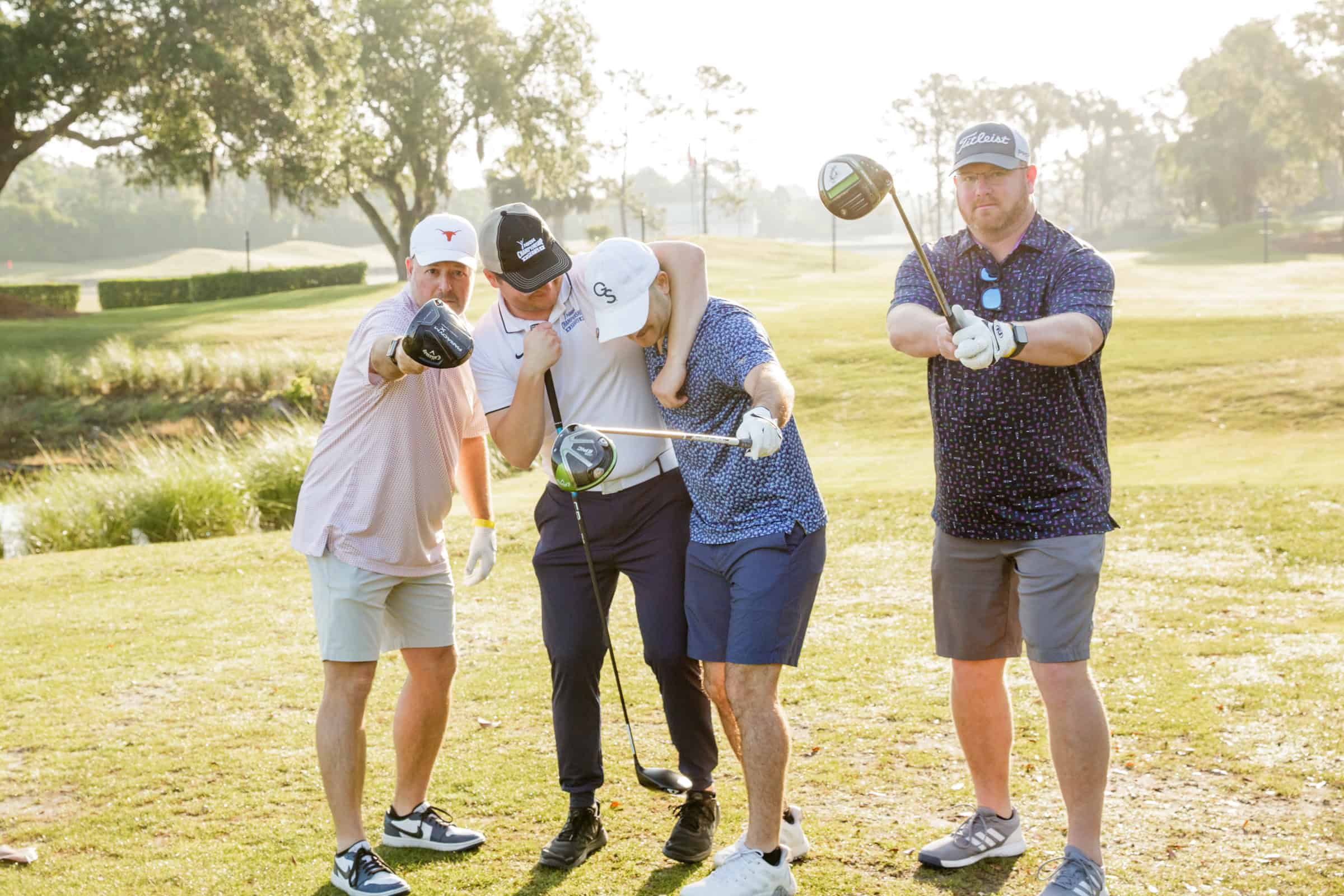 People posing during a golf game