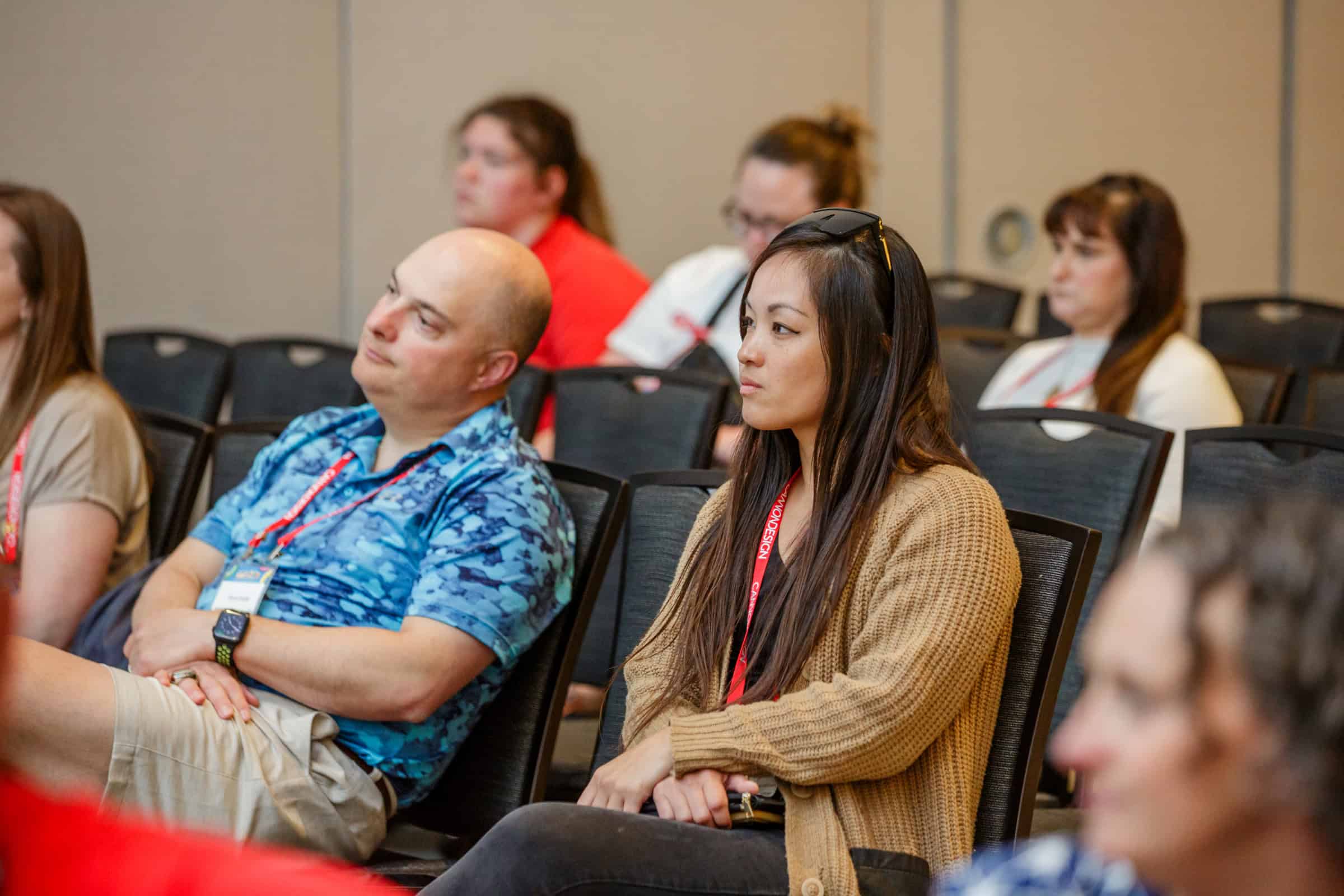 Conference attendees listening attentively at a seminar.