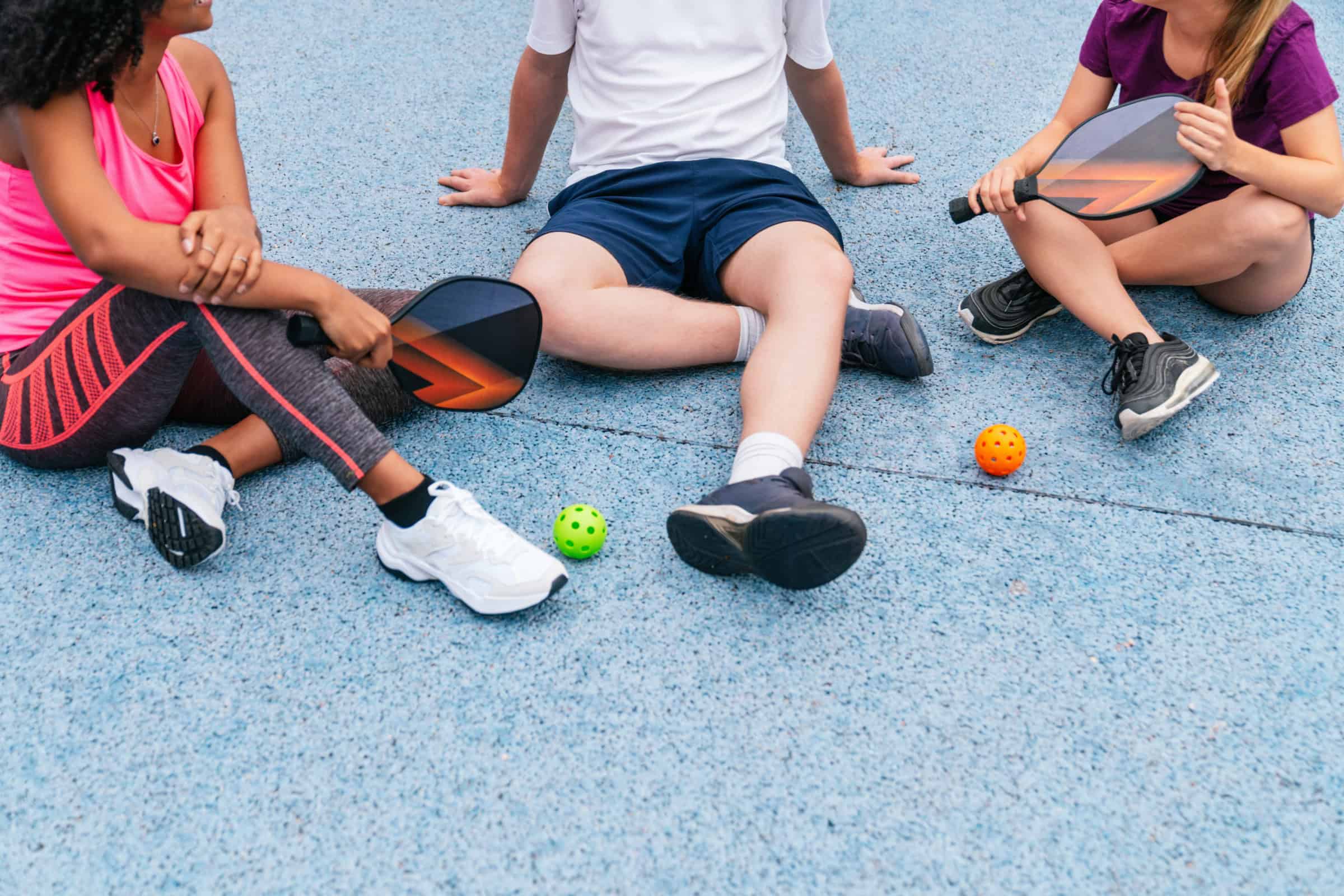 People sitting after a sports game