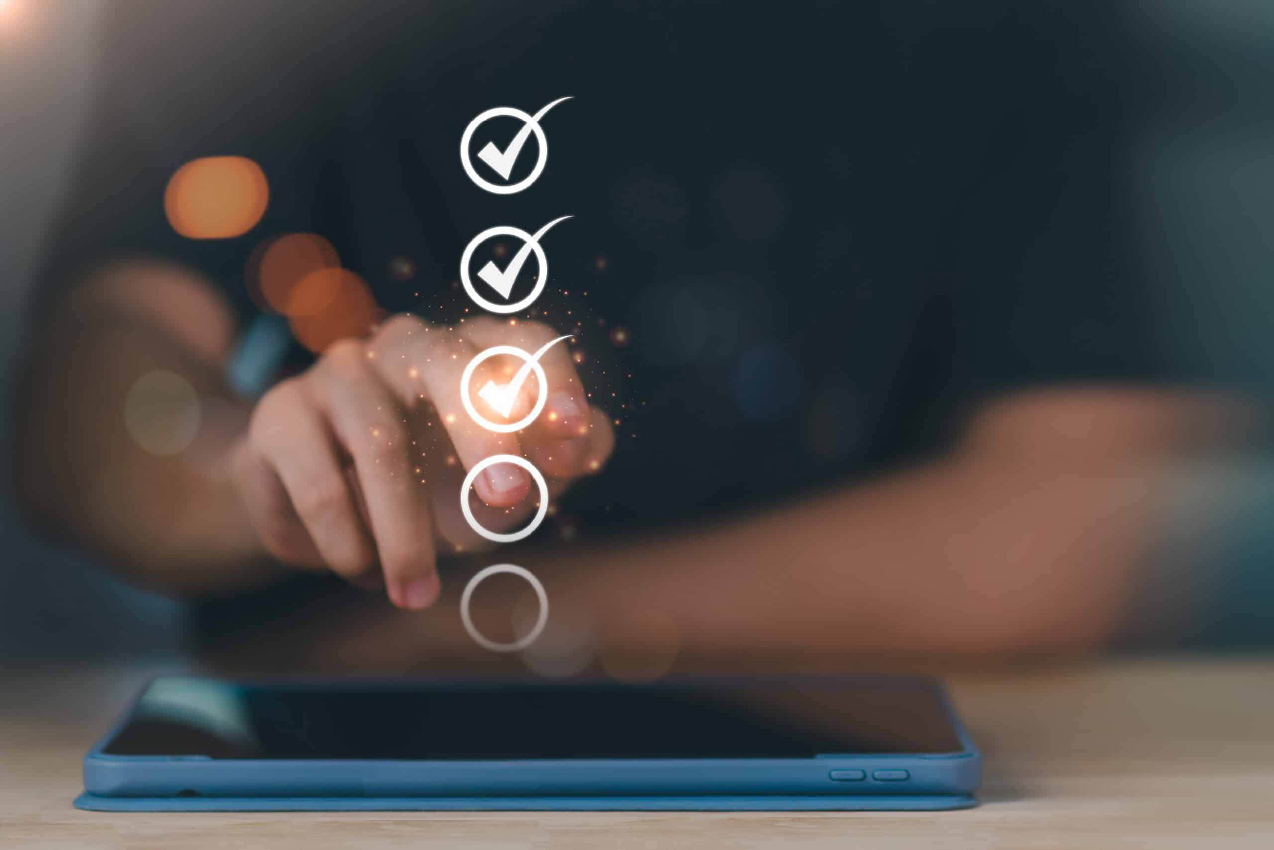 Checklist with a hand indicating progress