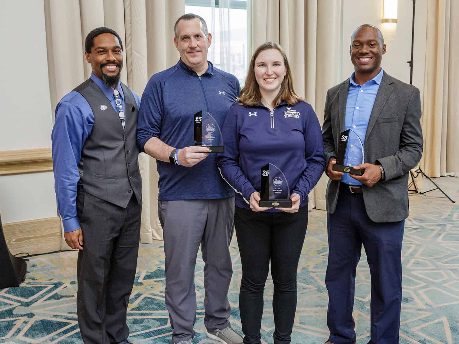 People posing with their awards at a NIRSA conference